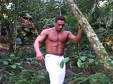 While exploring the woods on a warm day, 22 year old Herman Jurado comes across a posing Steve English. Inspired, Herman begins to oil up and put on a